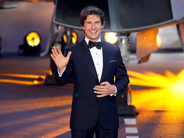 Tom Cruise kommt zur Premiere des Films «Top Gun: Maverick». Der US-amerikanische Schauspieler hat nach eigener Einschätzung viele Gemeinsamkeiten mit dem bristischen Prinzen William. Das sagte Cruise am Donnerstagabend der Nachrichtenagentur PA in London. Foto: Alberto Pezzali/AP/dpa